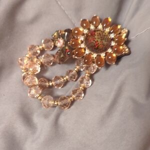 Elegant Gold and Brown Floral Brooch